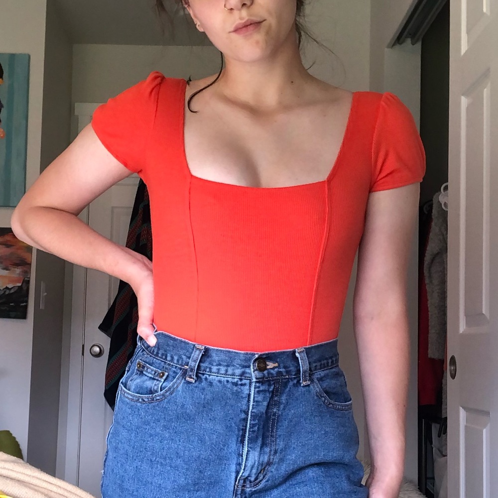 Orange body suit